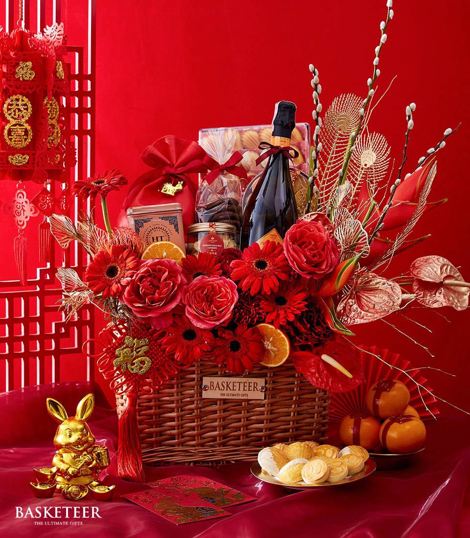 Luxury wicker basket with wine, premium gourmet treats, red roses, and gold accents for Chinese New Year prosperity
