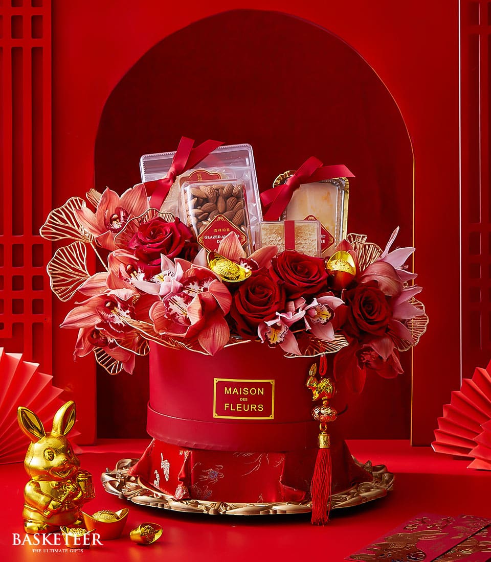 Grand Chinese New Year gift box with red roses, orchids, gold accents, glazed almonds and pastries