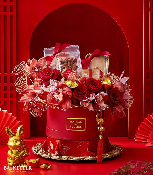 Grand Chinese New Year gift box with red roses, orchids, gold accents, glazed almonds and pastries
