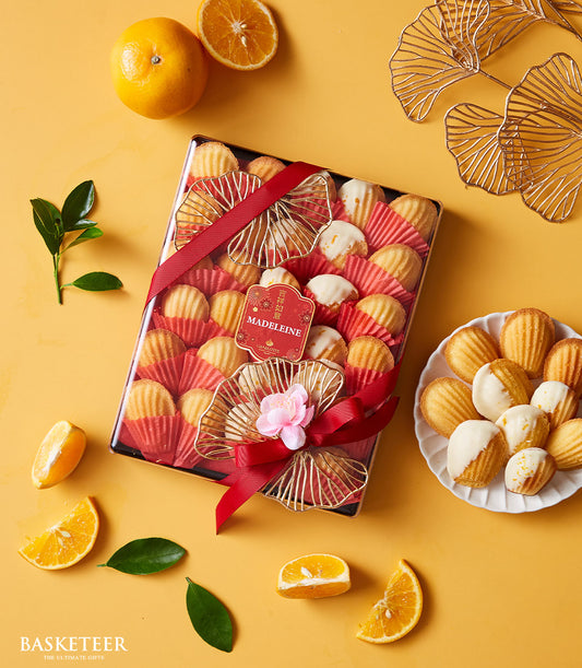 Artisan Mandarin Blossom Madeleines from Charlotte Bakery, beautifully gift-boxed with mandarin oranges. A perfect British bakery pastry gift for Bangkok delivery.