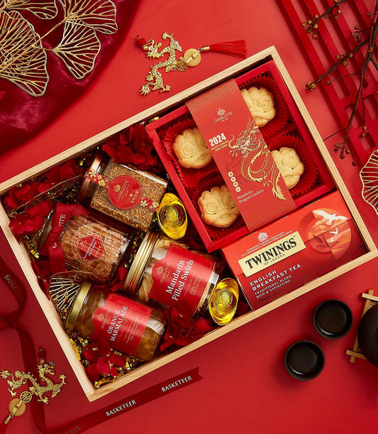 Lunar Sweets Wonders CNY gift box with cookies, tea, marmalade, gold ingots, and festive red décor