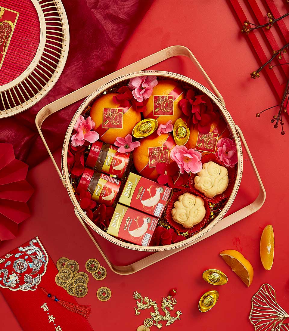 Charm of the Orient red and gold CNY gift basket with oranges, pastries, and traditional lucky coins for Chinese New Year