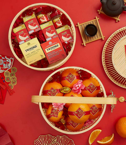Elegant Mandarin Swirls Blessings bamboo gift basket with red blessing boxes, dragon-wrapped oranges, premium tea, and gold