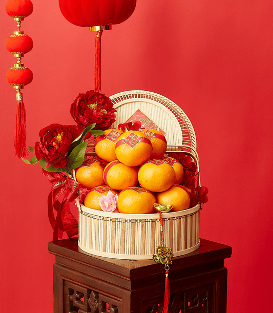 Imperial Mandarin Elegance bamboo basket with red-banded 2024 oranges, red peonies, and gold ingot charm for Chinese New Year