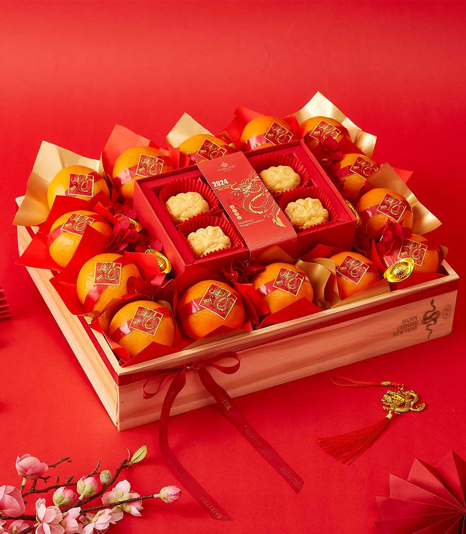 Mandarin Majesty lunar wood crate with red-wrapped oranges, cloud-shaped cookies, and gold dragon detailing for Chinese New