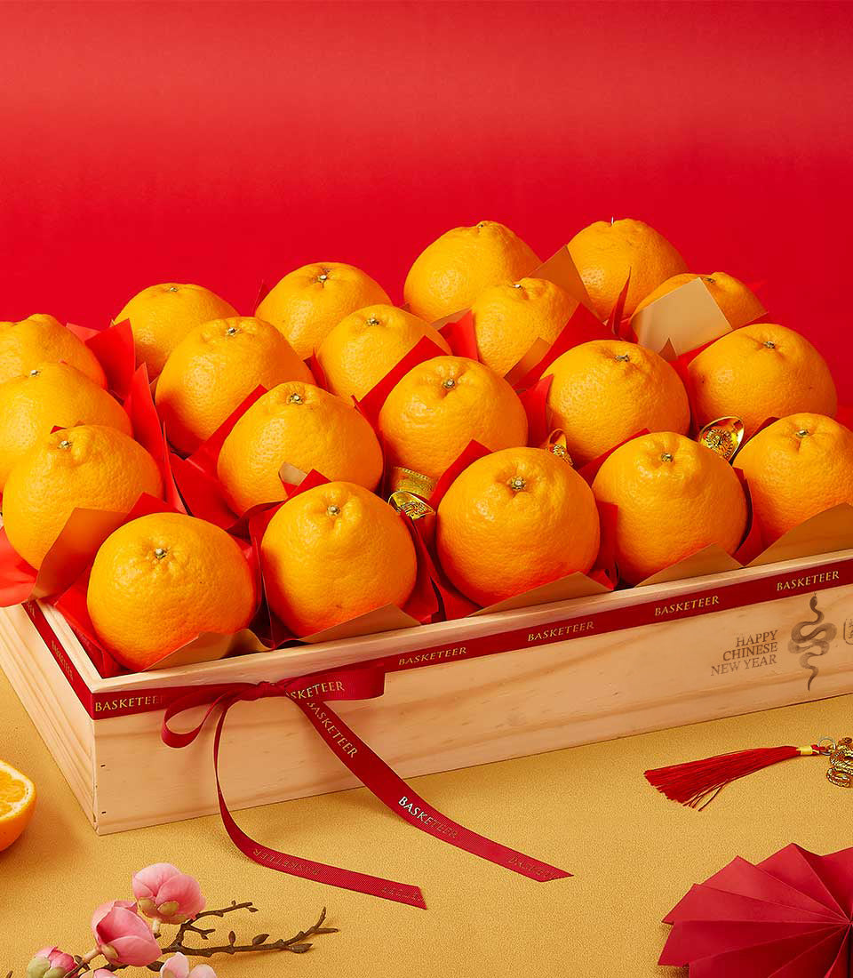 Premium Dekopon oranges in harvest wood crate with red and gold CNY wrapping, festive gift hamper
