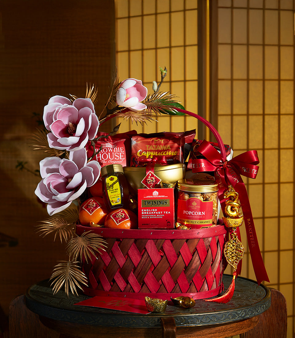 Premium red woven gift basket with gourmet treats, honey, tea, and festive gold accents for Chinese New Year celebrations