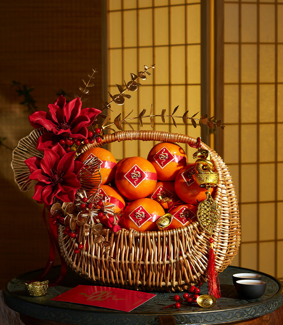 Prosperity Basket with auspicious oranges, red silk bands, and gold accents for Chinese New Year gifting