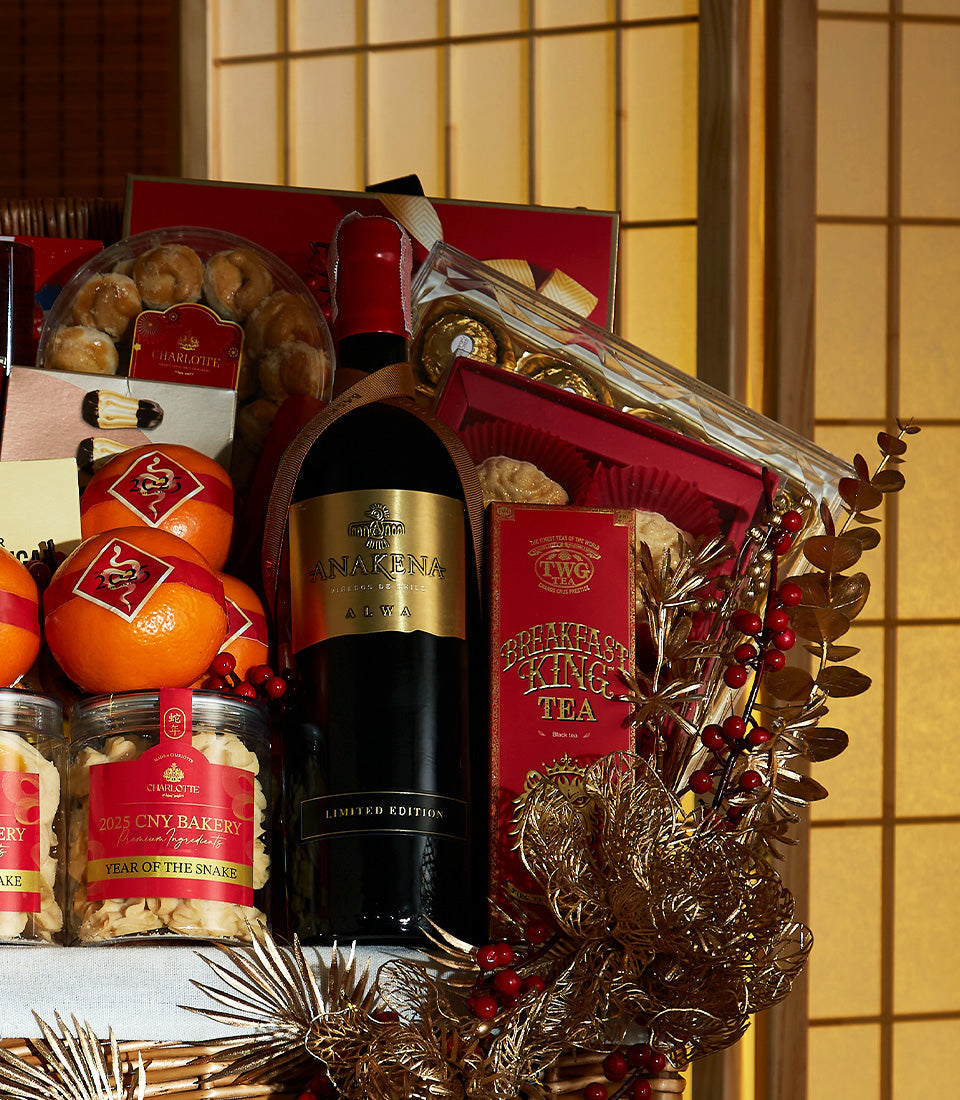 Chinese New Year wine gift basket with Anakena wine, festive oranges, CNY bakery treats, golden chocolates, and celebration