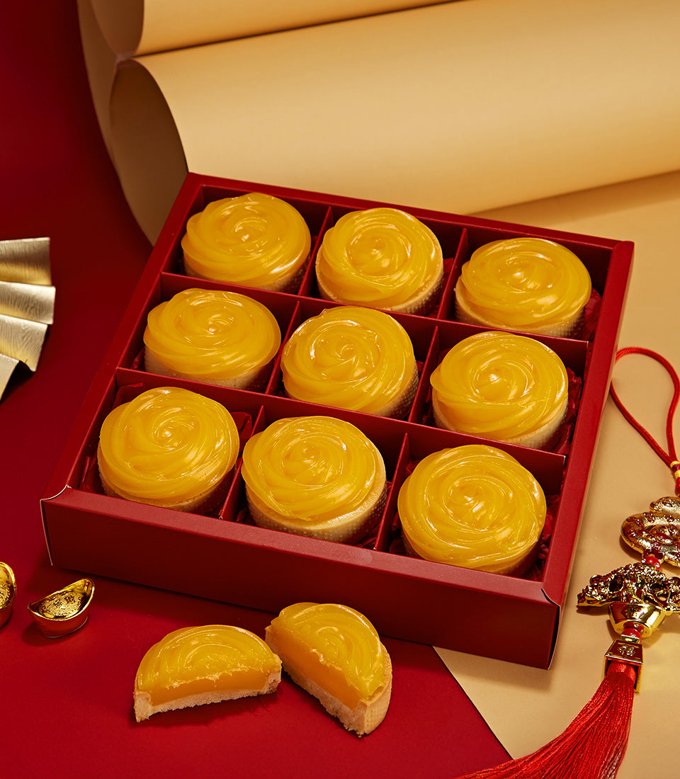 Mandarin orange tarts in red gift box with golden rosette topping, nine pieces for Lunar New Year