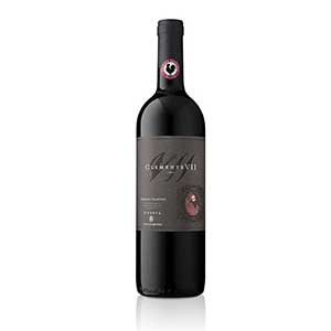 Premium red wine bottle with dark label, styled yuletide gift presentation for Christmas entertaining