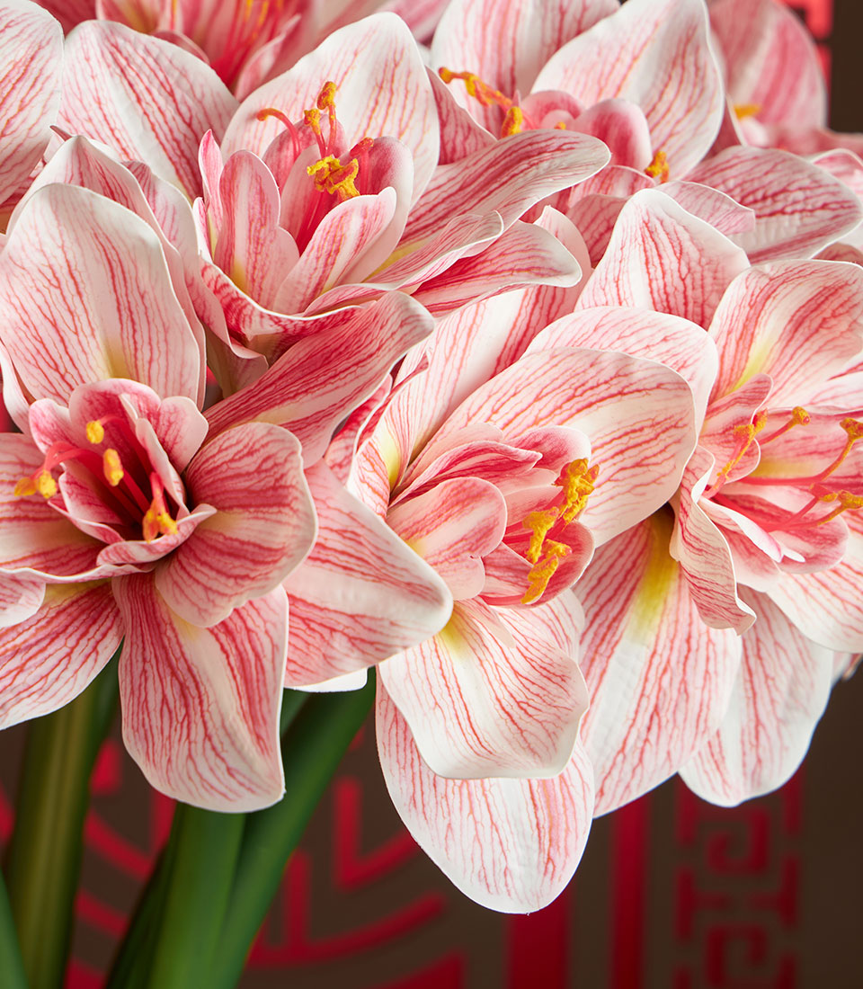 Basketeer premium gift: Pink-striped Amaryllis blooms, a luxurious artificial floral arrangement for Chinese New Year celebrations in Bangkok.
