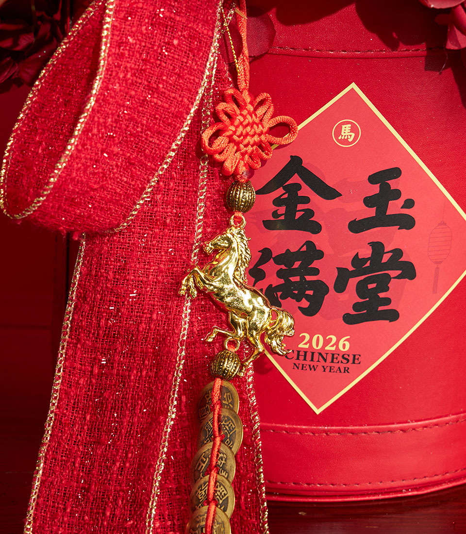 Basketeer premium hamper for Chinese New Year. Red gift box with gold horse charm, traditional knot, and rich ribbon. Perfect corporate gift Bangkok.