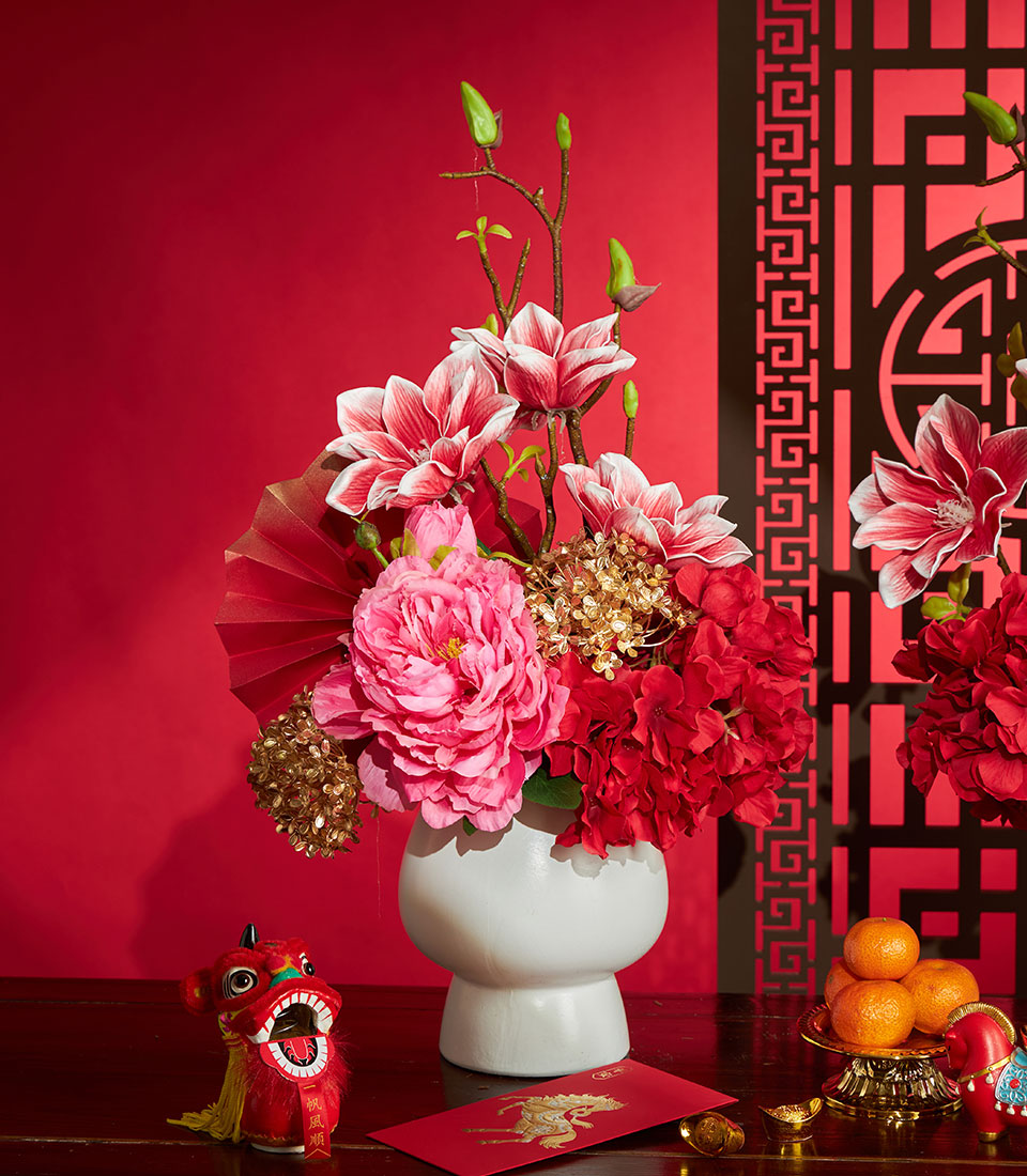 Basketeer premium hamper delivery Thailand: striking red and gold artificial flower arrangement for Chinese New Year, a luxurious gift for corporate gifting in Bangkok.