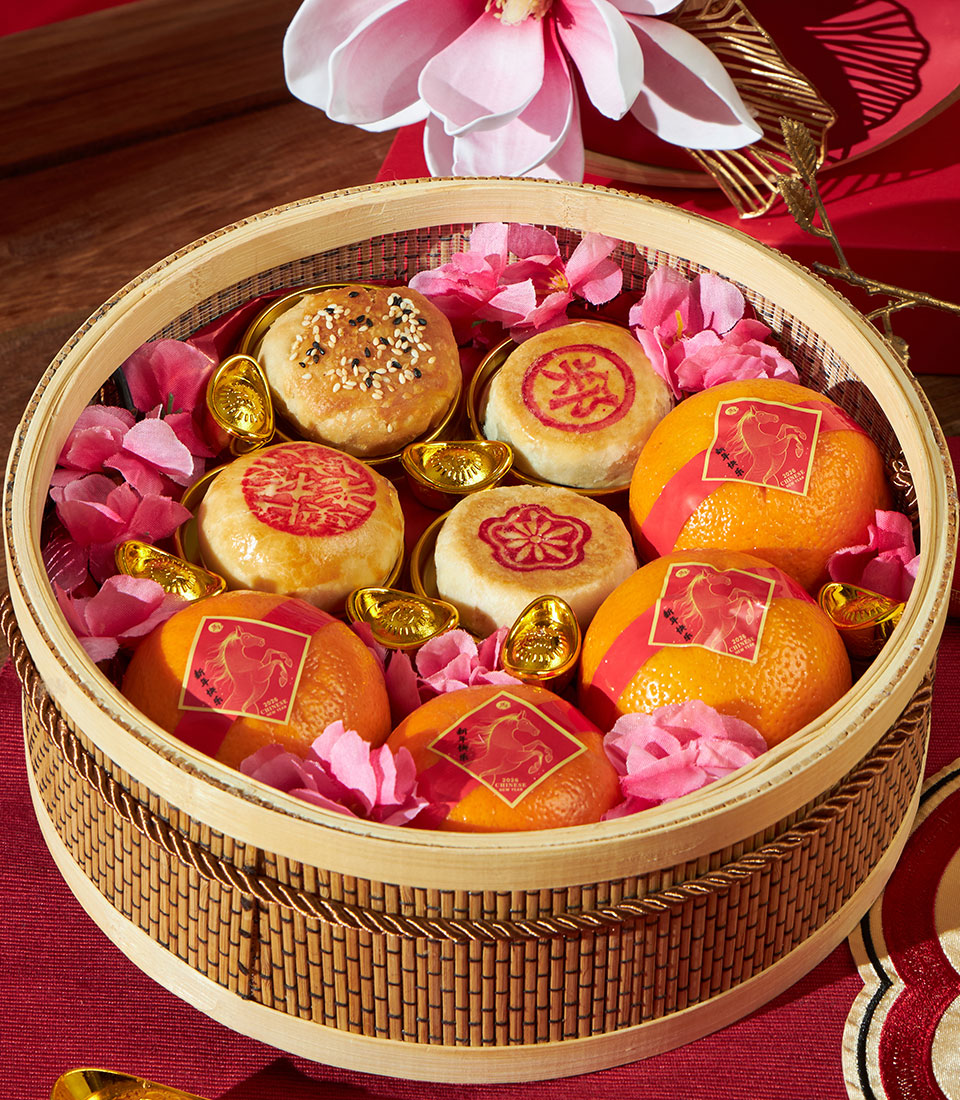 Mandarin oranges and fortune pastry gift basket with bamboo steamer, gold ingots, and Chinese New Year ribbon details