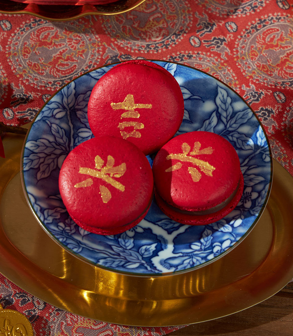 Lucky red macarons with gold Chinese characters on blue and white ceramic plate, Chinese New Year gift set