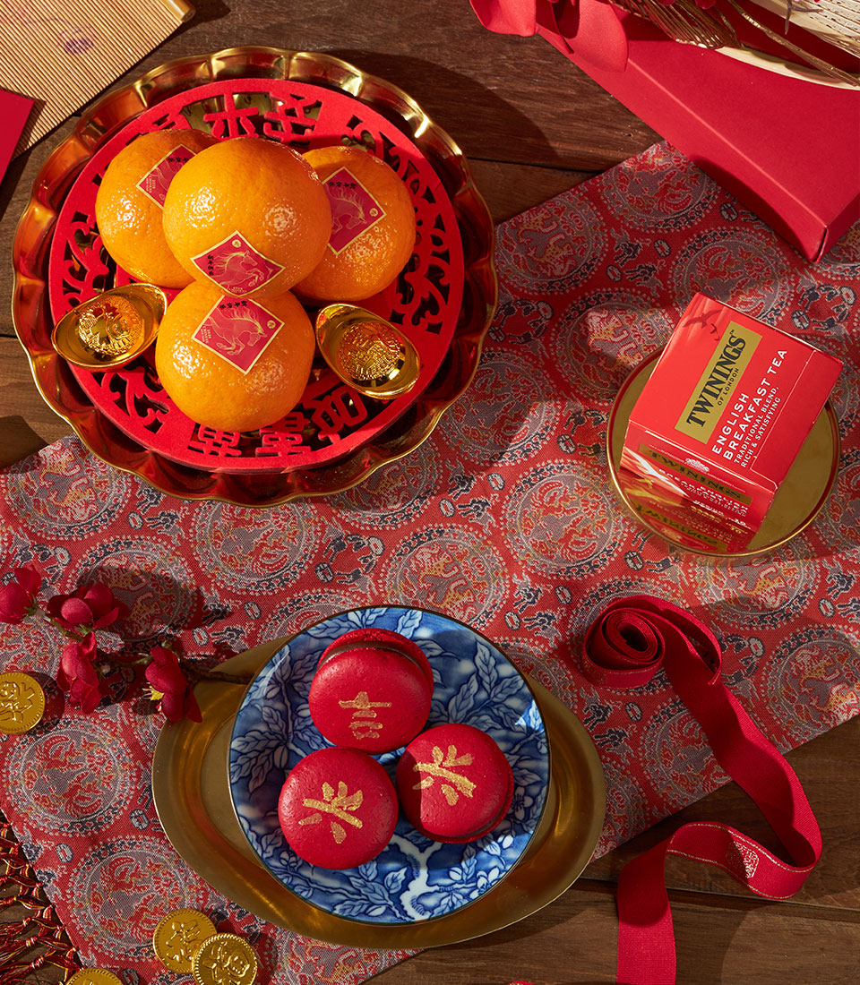 Mandarin, tea and macaron luxury gift set with gold accents for Chinese New Year celebrations