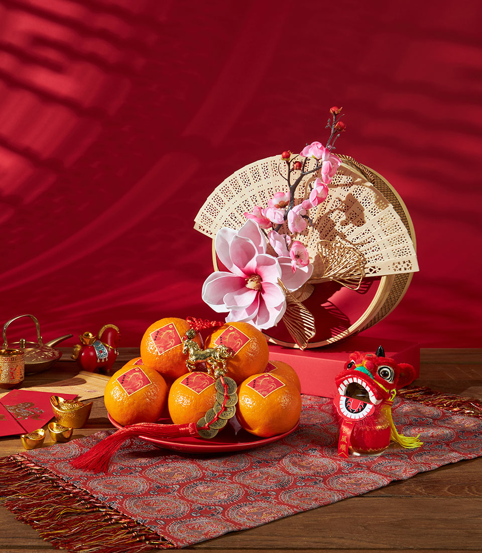 Premium mandarin orange gift set with gold horse charms and cherry blossoms for Chinese New Year
