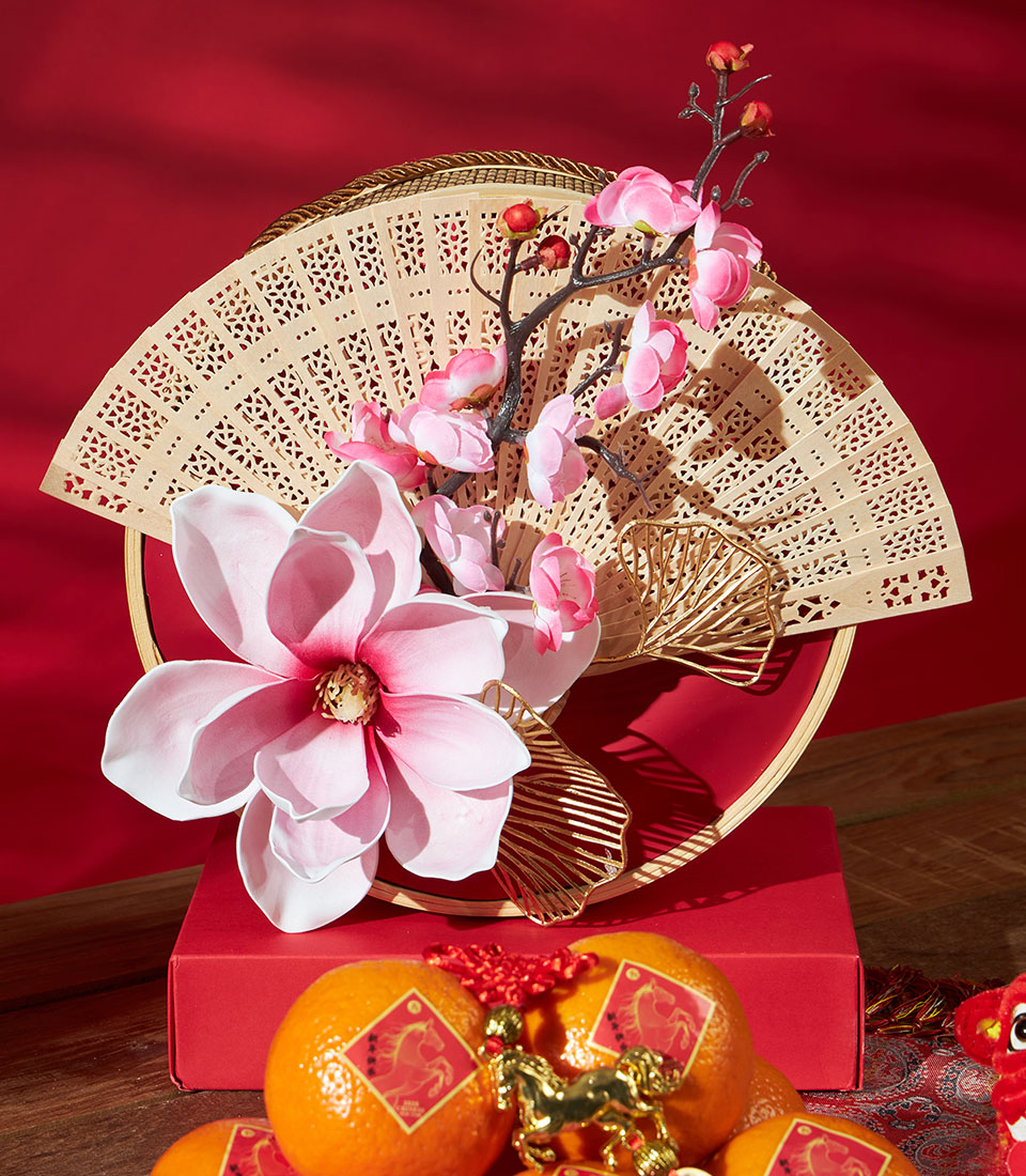 Premium mandarin orange gift set with decorative wooden fan, cherry blossoms, and red gift box for Chinese New Year