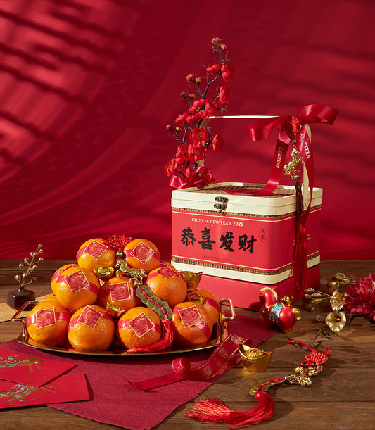 Festive Chinese New Year mandarin oranges gift box with red tiered packaging, gold horse charms, and lucky red envelopes on