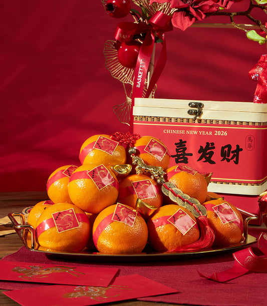 Luxury mandarin oranges gift box with gold accents and red ribbons for Chinese New Year