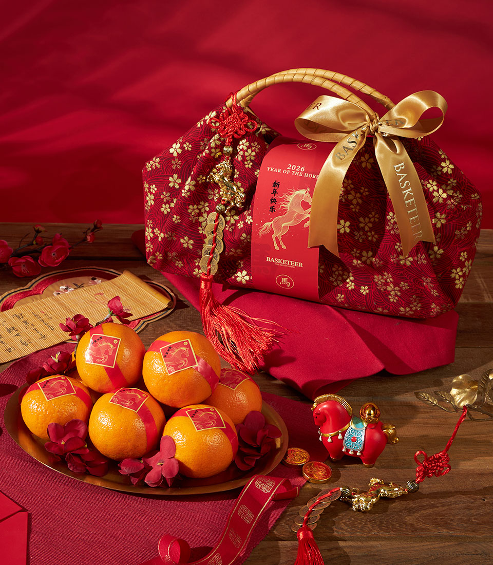 Gold mandarin oranges fabric gift bag with red floral basket for Chinese New Year celebration