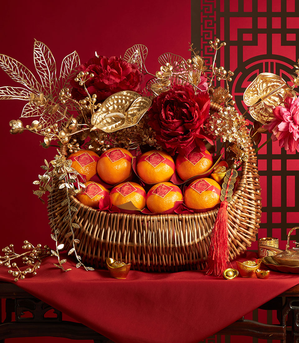 Premium Chinese New Year mandarin orange gift basket with red peonies, gold accents, and lucky coins