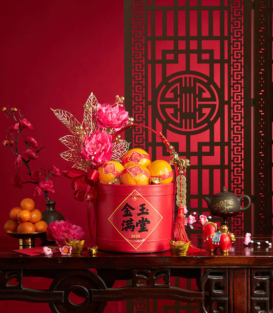 Chinese New Year mandarin orange gift basket with red box, artificial pink peonies, plum blossoms, and gold accents