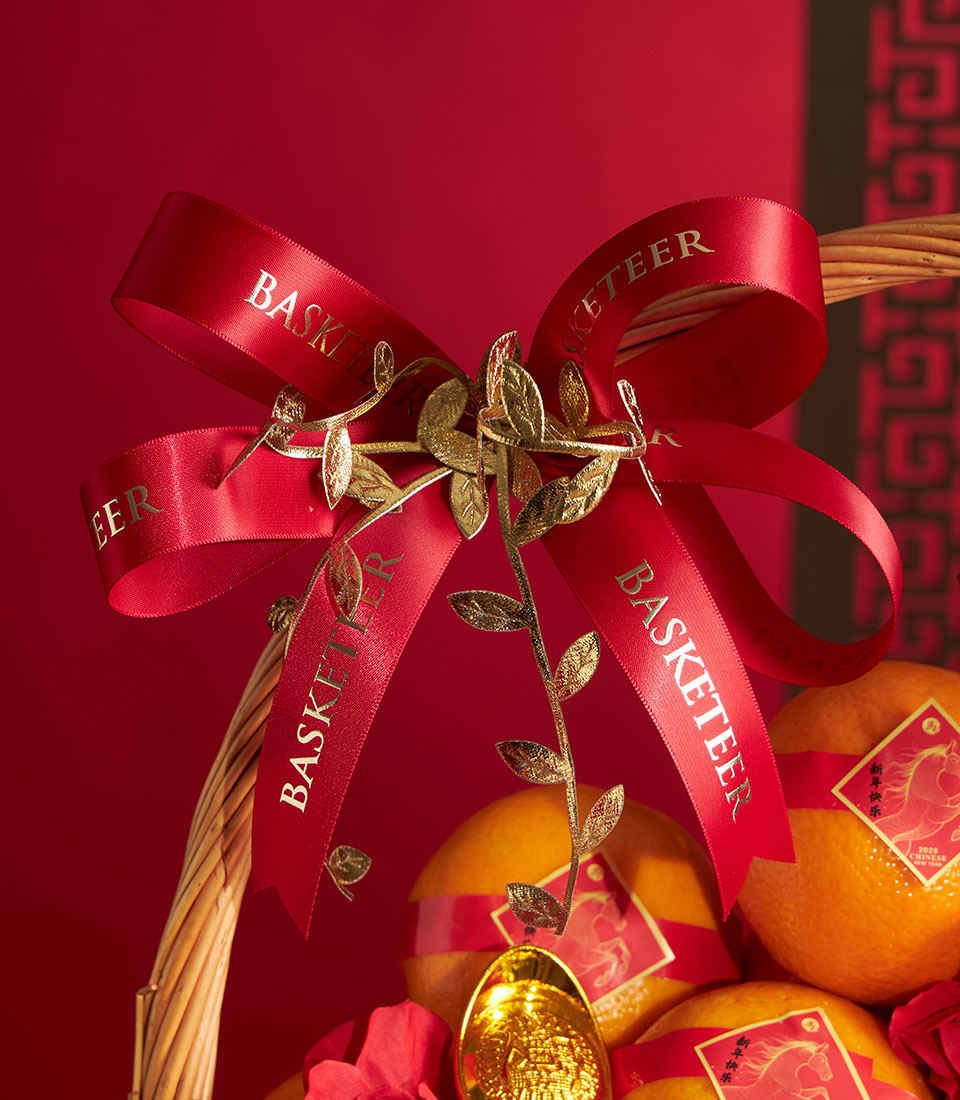 Prosperity Mandarin Orange Basket with red ribbon bow, gold accents, and lucky mandarin oranges for Chinese New Year