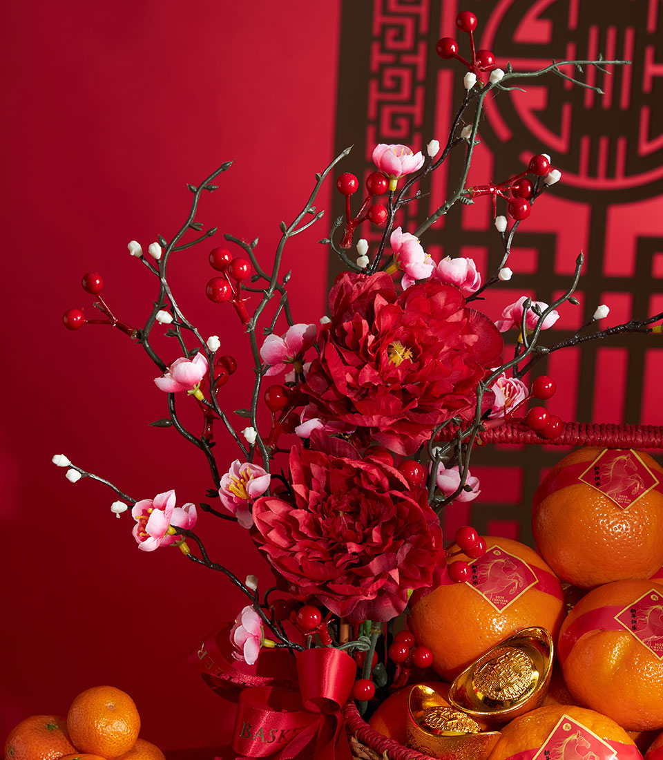 Lunar New Year mandarin orange basket with deep red peonies, cherry blossoms, and gold ingots