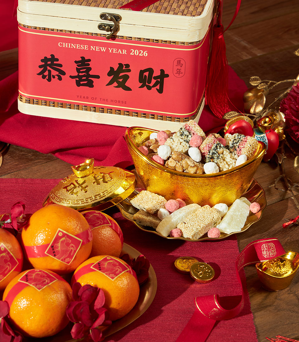 Mandarin oranges with red gold bands and Chinese New Year festive sweets gift set in bamboo-style box