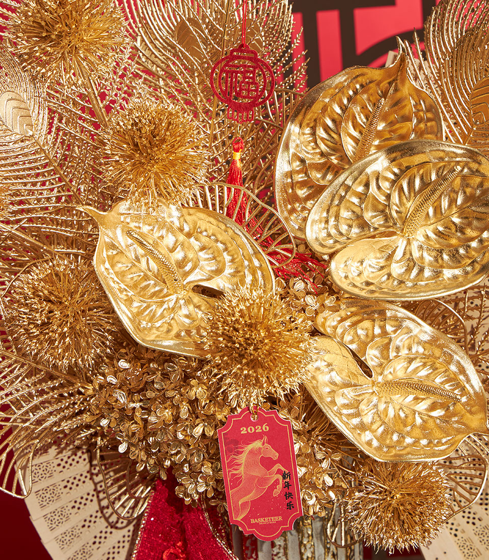 Basketeer premium hamper delivery Thailand: a luxurious Chinese New Year gift with golden artificial flowers and decorative accents for a prosperous 2026.