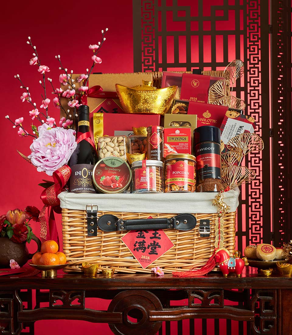 Luxury gourmet Chinese New Year gift basket with premium nuts, honey, coffee, tea, and non-alcoholic wine, adorned with
