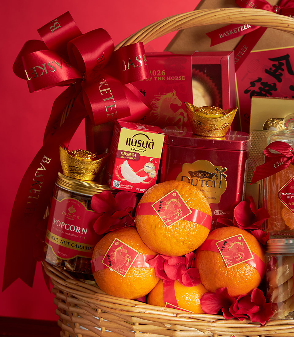 Festive red and gold Chinese New Year gift basket with mandarin oranges, gourmet treats, and golden prosperity symbols
