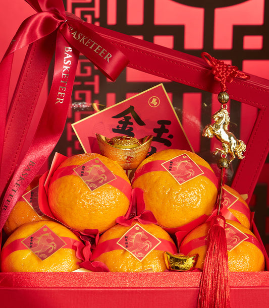 Premium XL mandarin oranges in festive red gift box with golden horse charm, red satin ribbon, and Chinese New Year 2026