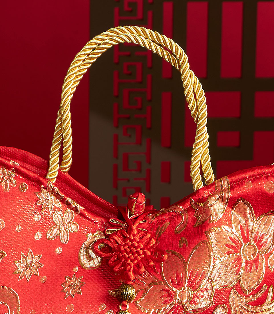 Red silk gift bag with gold embroidered flowers and traditional Chinese knot, Basketeer Chinese New Year hamper