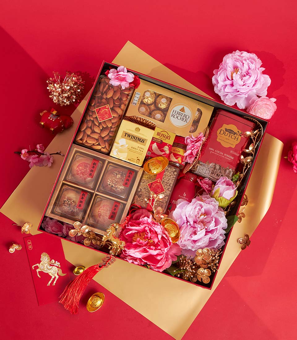 Luxury Chinese New Year gift box with mooncakes, Earl Grey tea, Ferrero Rocher, cocoa powder, almonds, red envelope and