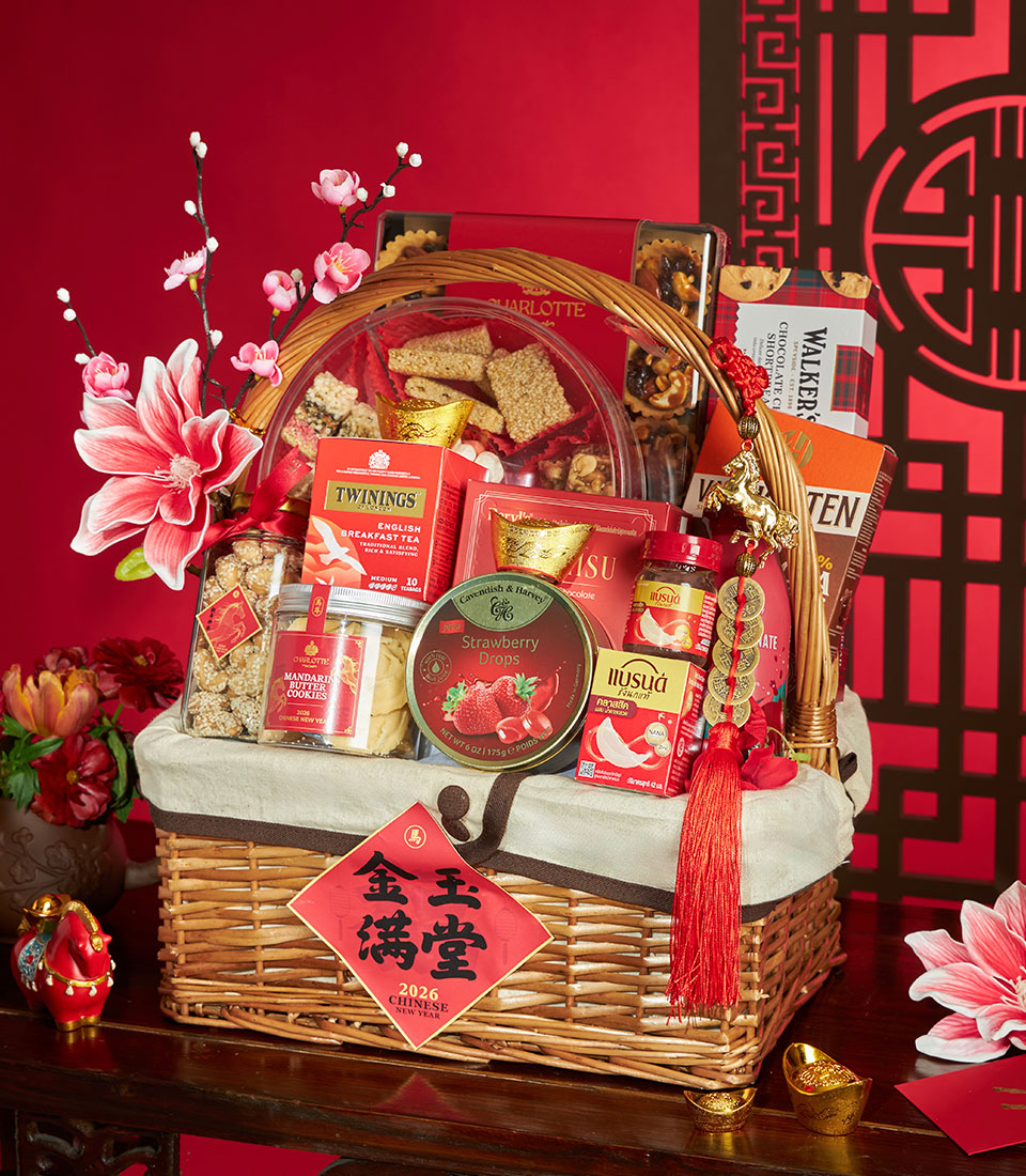 Woven wicker Chinese New Year gift basket with red accents, tea, cookies, and gold horse charm for festive prosperity