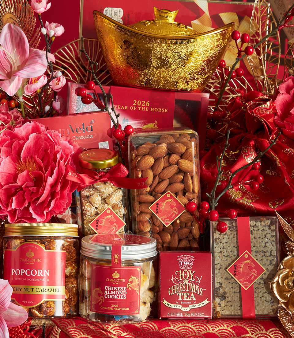Red and gold Chinese New Year luxury gourmet hamper with chocolate, almonds, cookies, tea, and festive horse-themed packaging