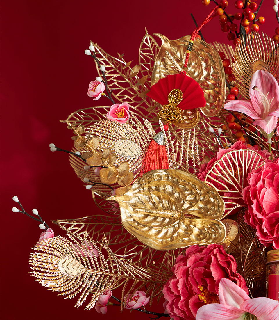 Ultra luxury Chinese New Year gourmet gift set with red peonies, gold metallic leaves, and festive ornaments