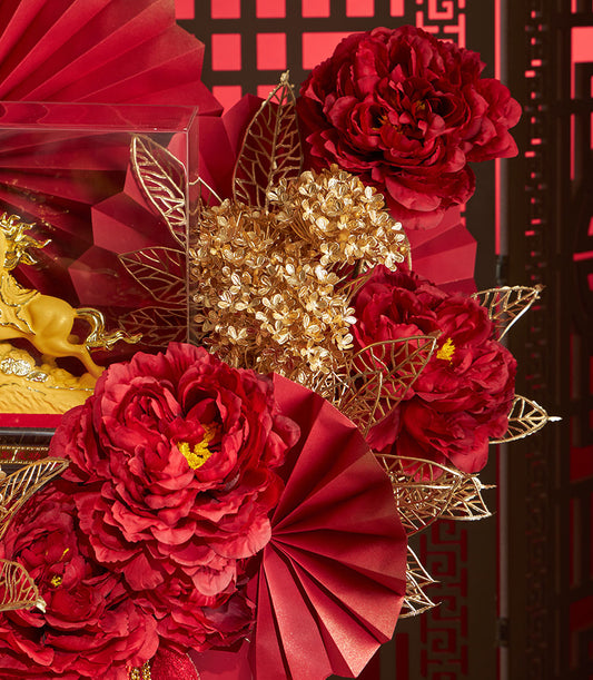 Luxurious Basketeer Chinese New Year gift: golden horse statuette in clear box, surrounded by rich red florals and gold accents. Premium hamper delivery Thailand.