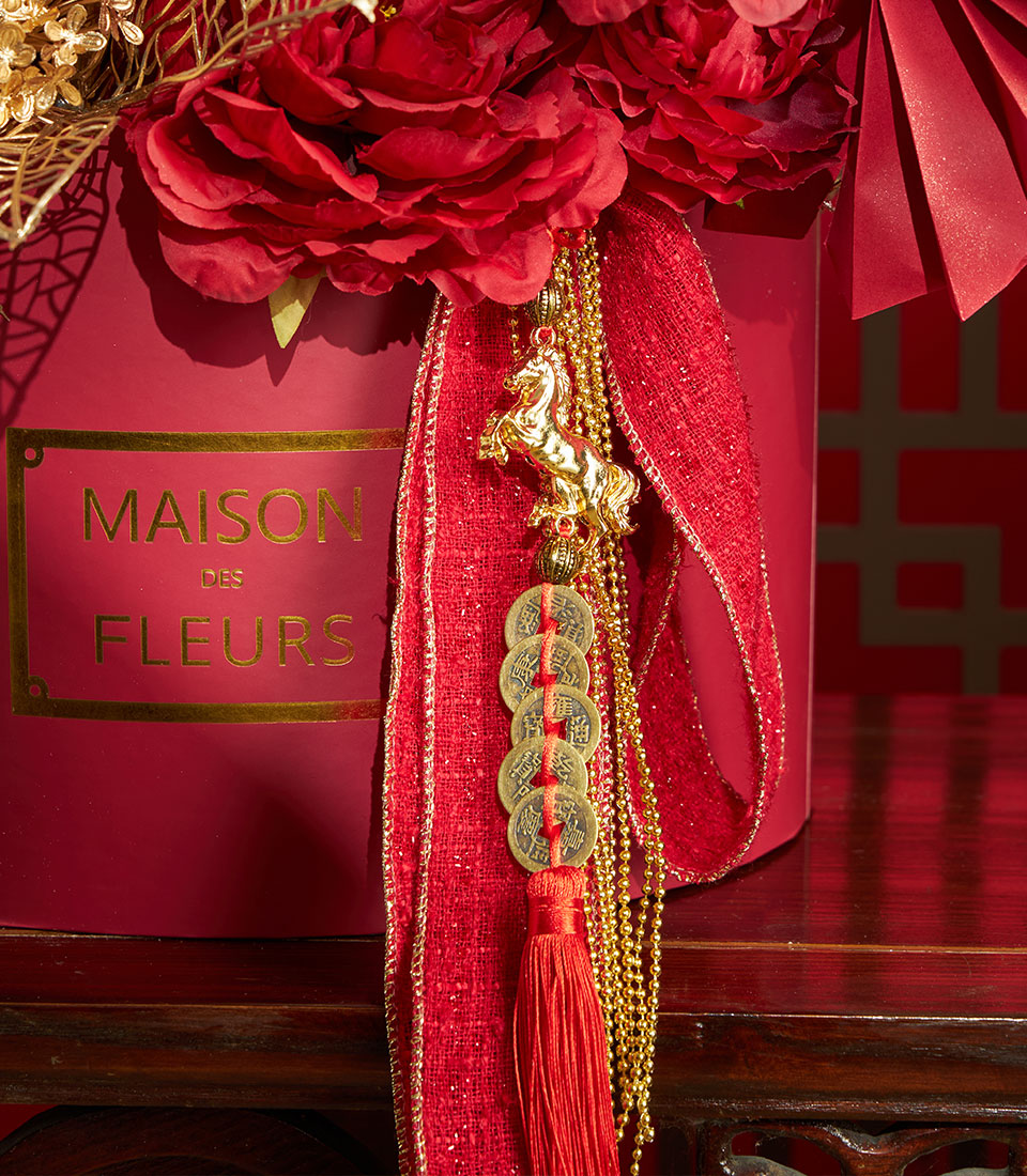 Basketeer luxury gift for Chinese New Year: gold horse charm and coins accent a red floral box with rich ribbon detail. A premium hamper delivery in Bangkok.