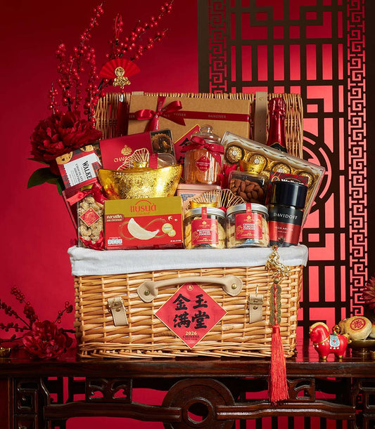 Premium Chinese New Year gift basket with gourmet treats, bird's nest, cookies, champagne, and luxury goods in woven wicker