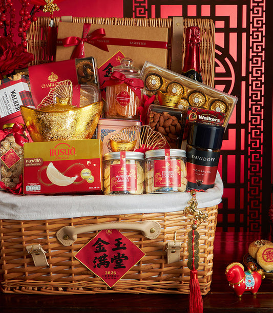 Red and gold Chinese New Year gourmet basket with sparkling wine, bird's nest, mandarin cookies, and lucky charms