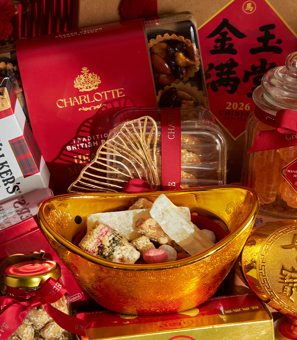Red and gold Chinese New Year luxury gift hamper with Charlotte Bakery tarts, cookies, candied fruits, and traditional sycee