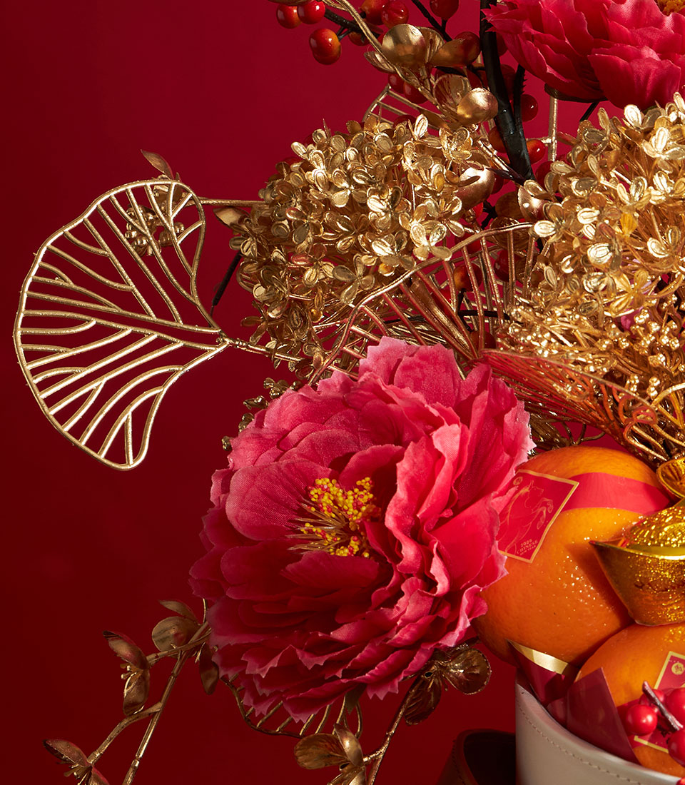 Luxury mandarin orange gift basket with fuchsia peonies and gold accents for Chinese New Year