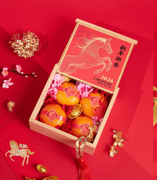 Luxury mandarin orange gift box with dragon design, gold ingots, and red festive packaging for Chinese New Year