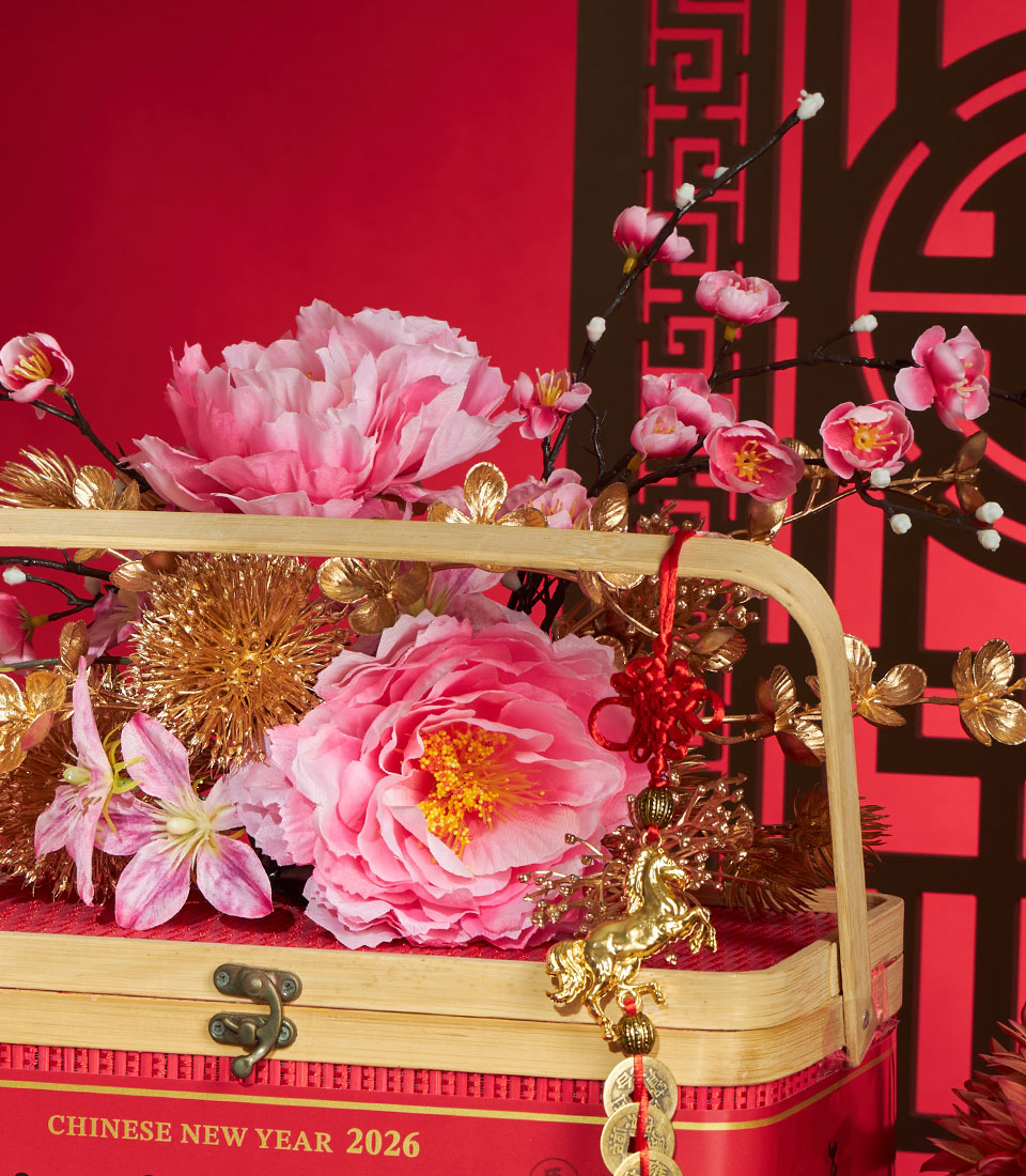 Festive red gift box with Chinese New Year 2026 design, bamboo handle, pink peonies, golden ornaments, and lucky red knot