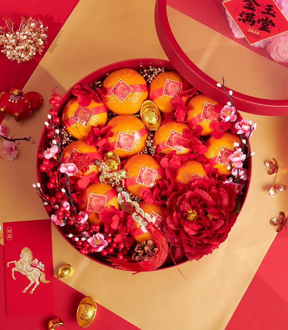 Premium mandarin orange gift box with red peonies, golden accents, and Chinese New Year decorations