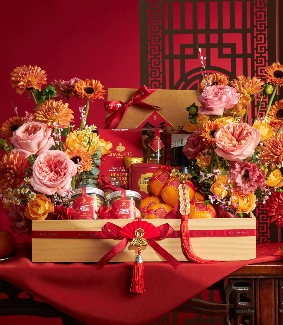 Luxury Chinese New Year gift hamper with gourmet cookies, honey, Charlotte Bakery treats, and fresh mandarins in wooden